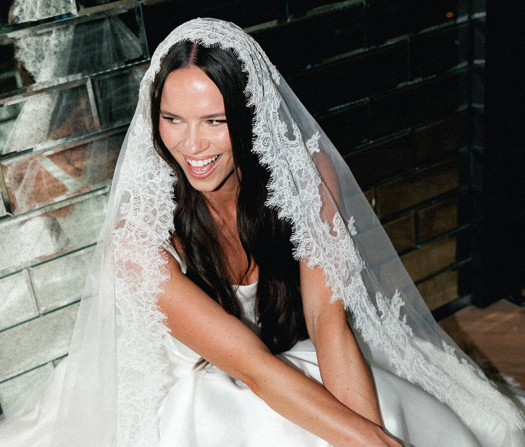 Bride with embroidered lace veil